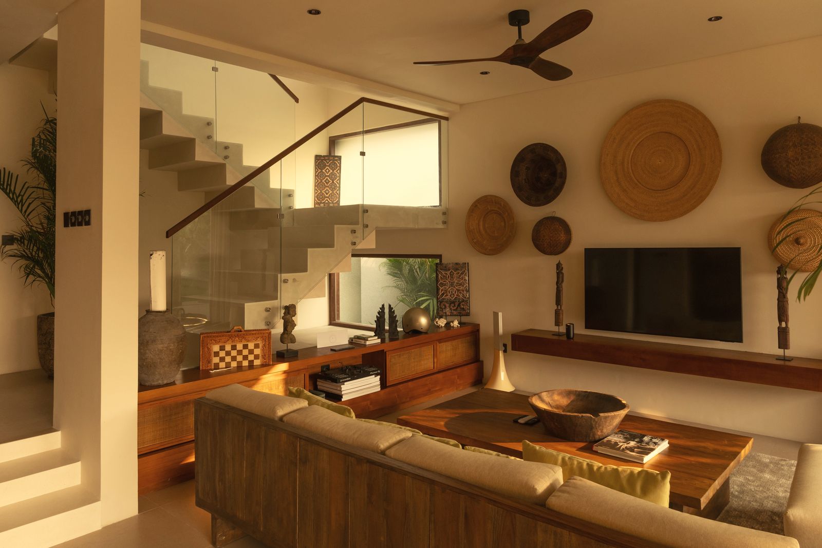 Living room with floating concrete staircase