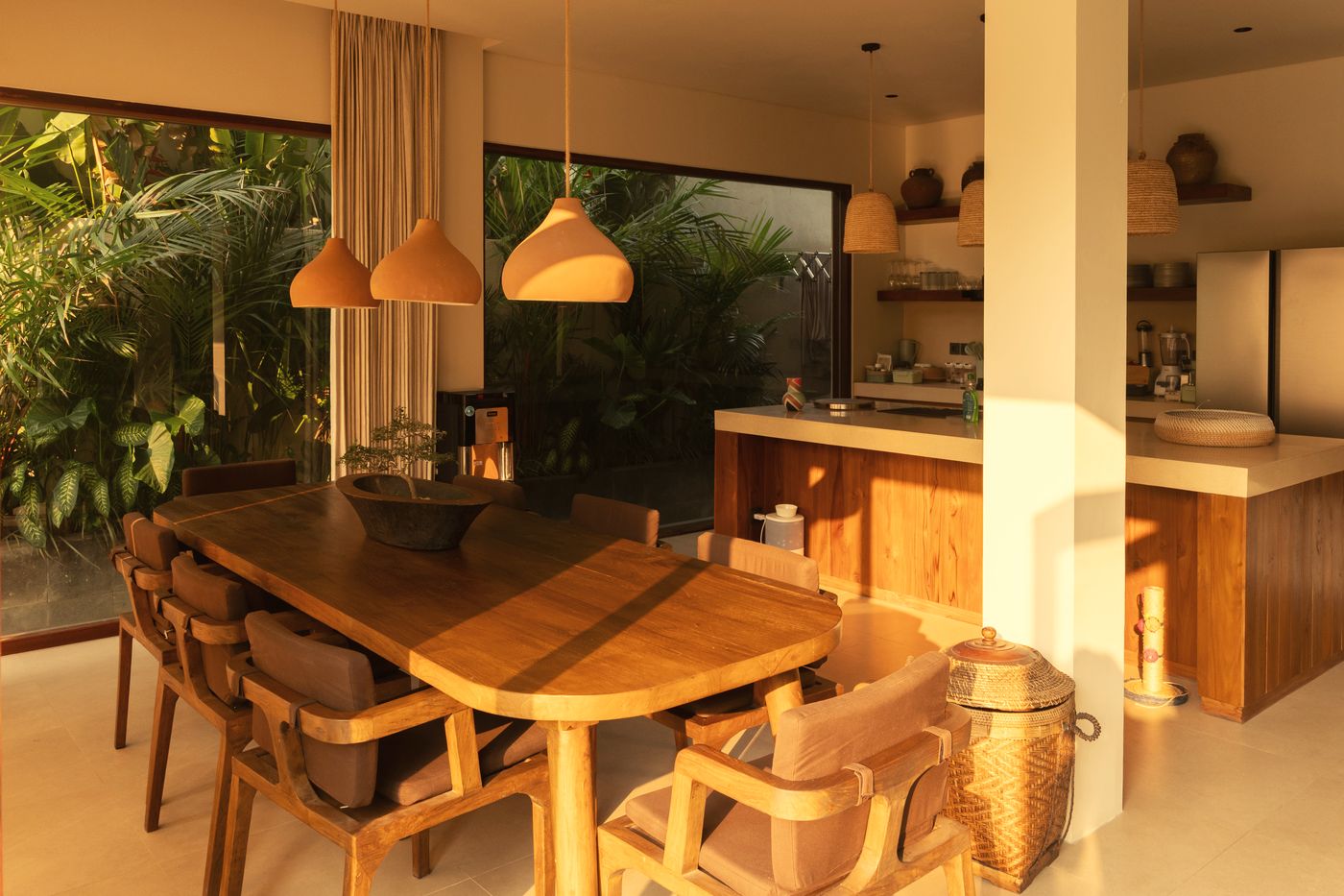 Dining table and open kitchen in warm light